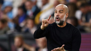 Man City manager Guardiola to miss two matches after back surgery