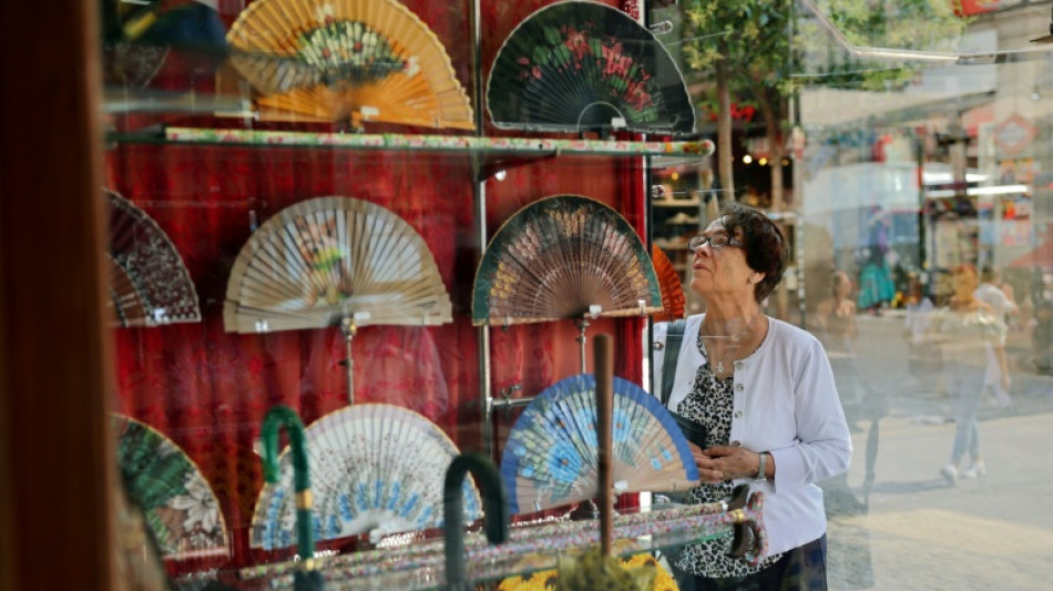 Passion for hand fans sizzles in burning Spanish heat