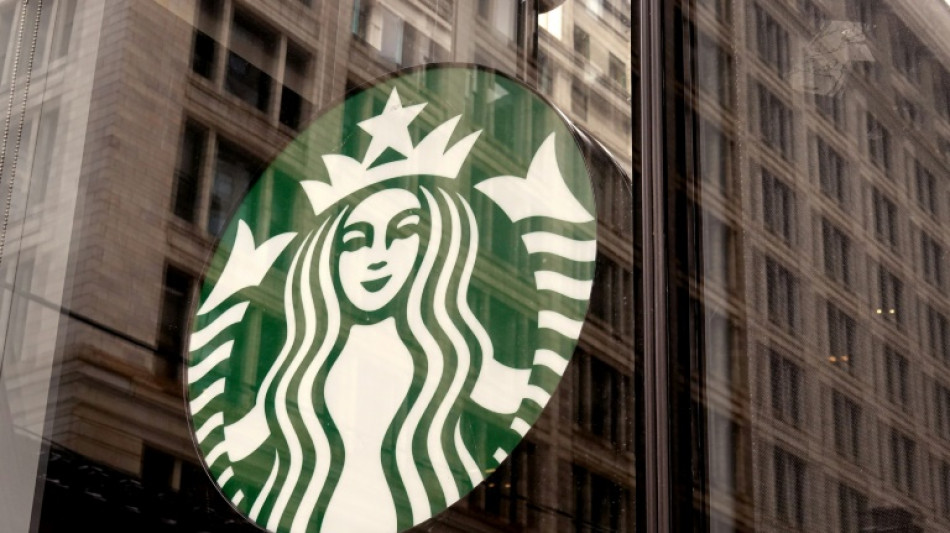Starbucks interim CEO Schultz to suspend share buyback program 
