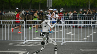 Humans far behind as robot breaks record at Beijing half marathon