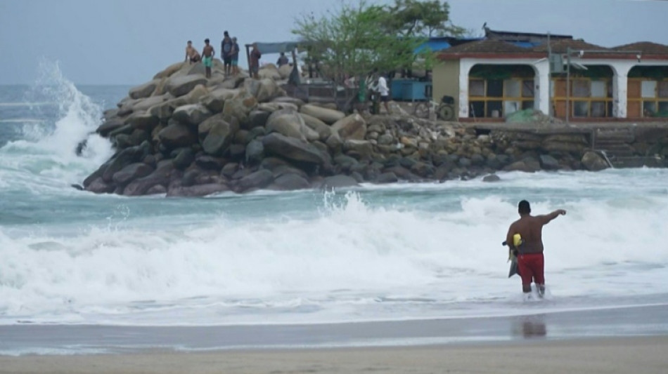 Tourists, fishermen hunker as Hurricane Erick pounds Mexican coast