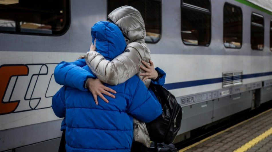 War or no war, Ukrainian families board train home