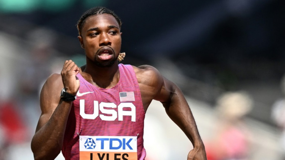 Lyles cruises into 200m semis in quest for sprint double