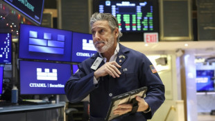 Wall Street termine en hausse, satisfaite par la Fed