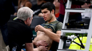 Alcaraz retires with injury as Auger-Aliassime powers into semi-finals