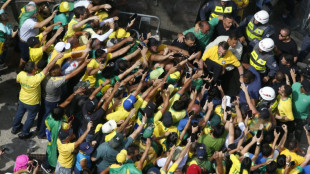 Brazil's Bolsonaro slams election ban as thousands rally behind him
