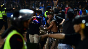 Chaos before stampede delivered disaster to Indonesia football fans