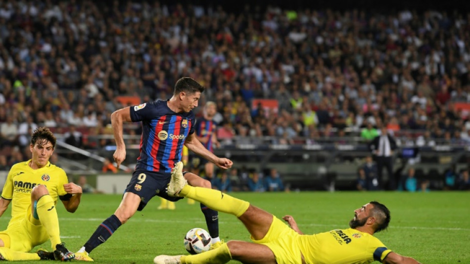Lewandowski double eases Barca woes in Villarreal rout