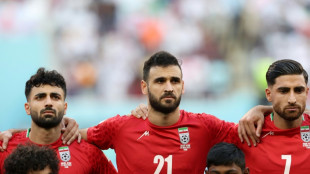 As protests rage in Iran, team fall silent for anthem at World Cup