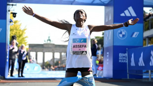 Assefa smashes women's marathon world record in Berlin, Kipchoge wins men's race