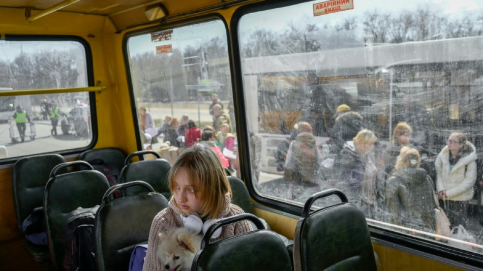 Red Cross evacuee convoy arrives from Russian-held city