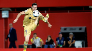 Lewandowski strike earns Barca narrow win at Mallorca