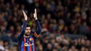 Pique takes Camp Nou bow as Barca beat Almeria to go top