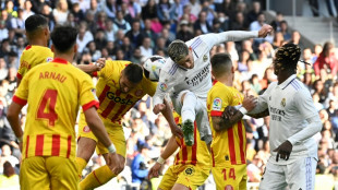 Leaders Madrid drop points at home in Girona draw