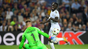 Bayern seal top spot as eliminated Barca fail to salvage pride