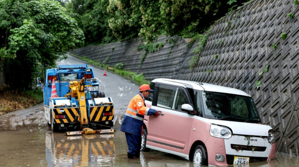 Four injured, flights cancelled in Japan as twin storms approach