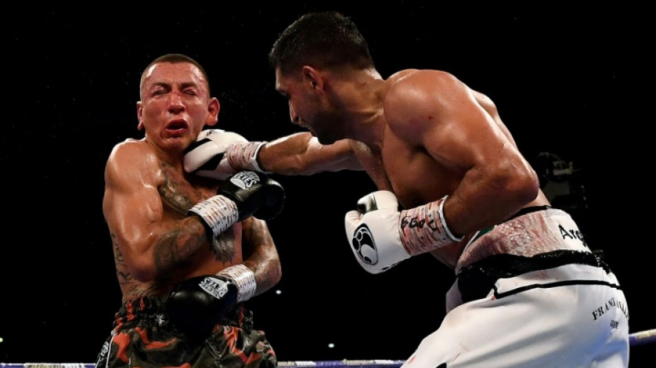 Ex-world champion Khan handed two-year ban for doping