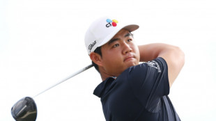 Bogey-free Tom Kim shares Hero World Challenge lead